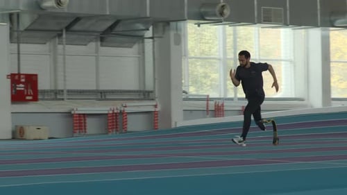 Dedicated Athlete Runs on Indoor Track