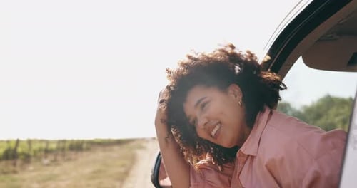 Happy Woman Enjoying Road Trip Through Rural Landscape