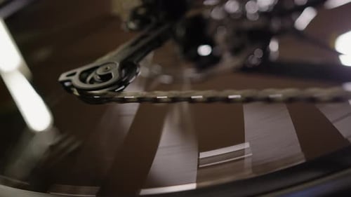 Close-Up of Spinning Bicycle Gear and Chain in Motion – High-Speed Cycling Mechanics Detail - UHD