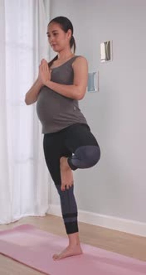 Pregnant Woman Practicing Yoga for Health and Wellness