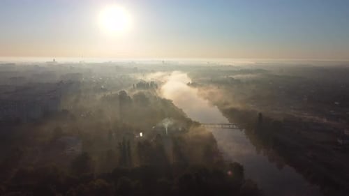 Forest Park Trees River and Many Highrise Buildings in City in Early Morning
