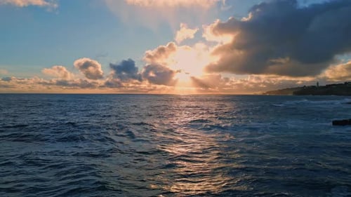 Amazing Bright Marine Sunset Over Ocean Surface Reflecting Evening Light Aerial