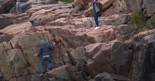 Man Climbing on Rocky Cliff, Forest Mountains Beach National Park Active