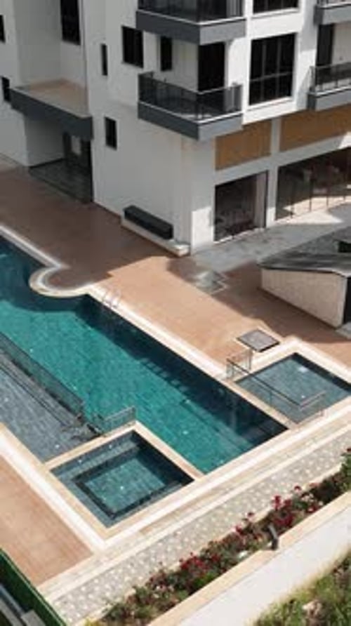 Vertical Video Flying High Above Kid's Water Playground Aerial Exploration of Water Slides