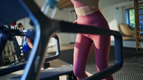 Energetic Runner Training Jogging Machine Closeup Woman Running on Treadmill