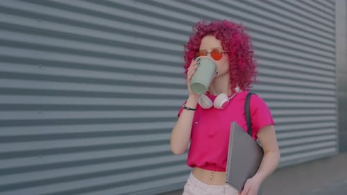A Pink Curly Woman is Walking to Work or College