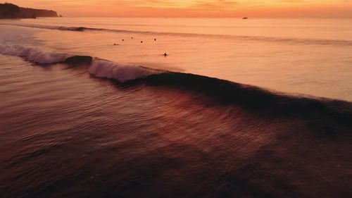 Ocean with Perfect Crashing Waves with Evening Sunset Sunlight Drone View