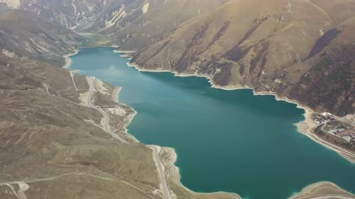 Aerial Stunningly Beautiful Alpine Lake Surrounded By Majestic Spring Mountains