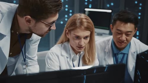 Team of Scientists Reacts to Success at Computer
