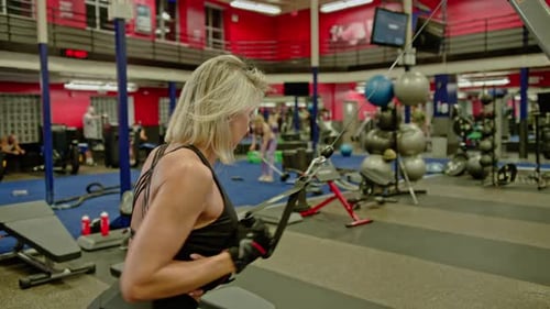Fit Woman Working Out at the Gym