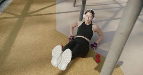 Woman Doing Seated Workout Outdoors
