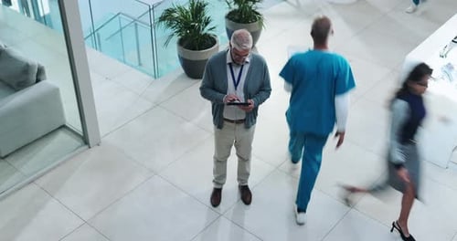 Healthcare, administration and man in hospital with tablet, report or planning online schedule