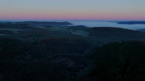 Valley in mist at sunrise, magical landscape with mist