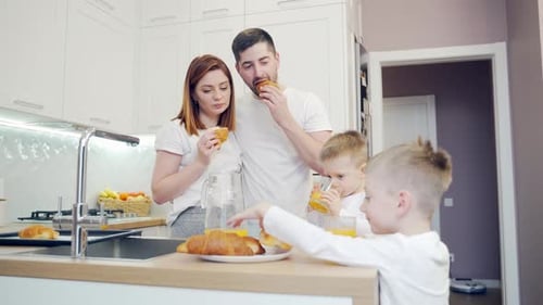 Family Enjoys Breakfast Together in Bright Kitchen