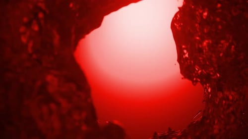 Turbulent red liquid vortex forming a funnel. 3d loop animation 4k