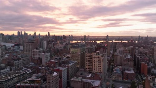 Sunset Bathing Manhattan in Warm Hues Highlighting the Skyline While Buildings Cast Long Shadows