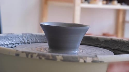 Ceramic Cup on Pottery Wheel Gray Clay in Workshop for Creating a Mug Concept of Creativity Handmade