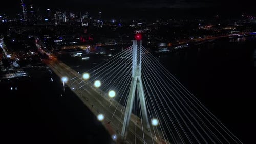 Aerial panoramic shot of Warsaw cityscape. Swietokrzyski suspension bridge over Vistula river, skysc