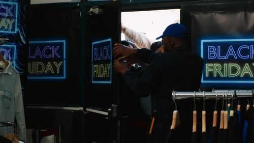 Customers Push into Retail Store on Black Friday