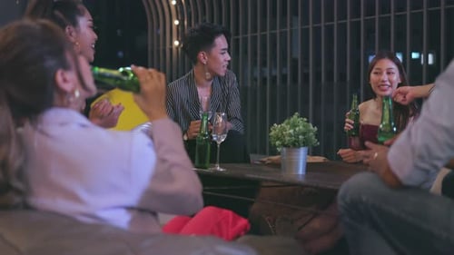 Friends Gathering for Drinks at Urban Night Event