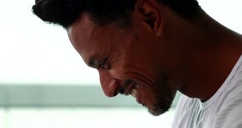Smiling Man Close-up Wearing White T-Shirt