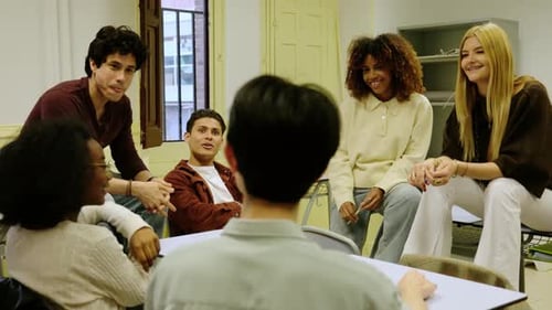 Diverse high school students collaborating in a group therapy session