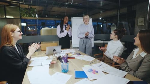 In a Modern Office a Talented Group of Women Collaborates Showcasing Diverse Interactions and