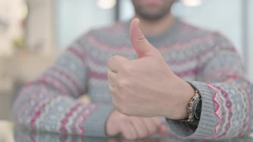 Hand Close Up of Thumbs Up