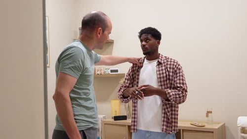 Two Men Talking in a Home Interior Setting
