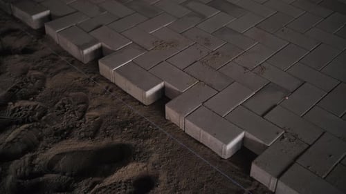 Laying Paving Bricks on Sand Base