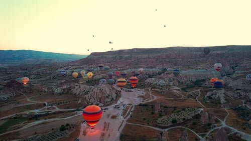 Hot Air Balloons Soar Over Cappadocia Landscape