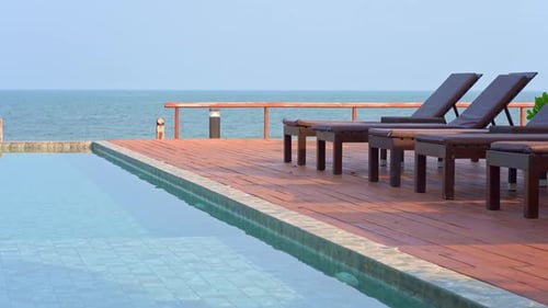 View of the exterior of a luxury resort with swimming pool and ocean view