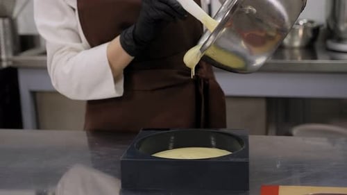 Creamy Batter Poured into Baking Mold in Kitchen