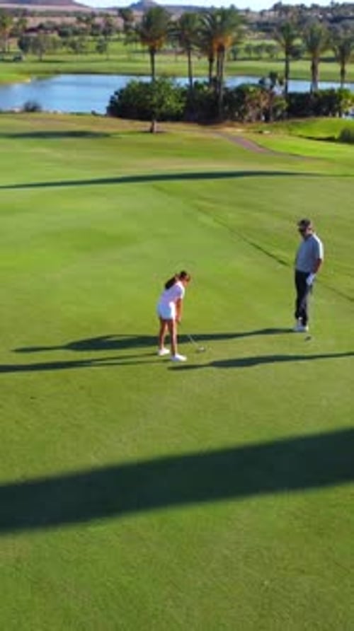 People Playing in a Luxury Golf Course in Summer