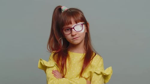 Girl Wears Eye Patch and Glasses