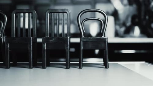 Chairs Lined Up Close Up in Black and White
