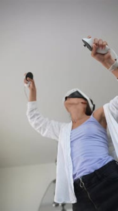 Person Wearing VR Headset Using Controllers