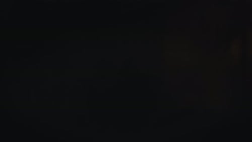 Illuminated Jack-o'-Lantern shrouded in fog