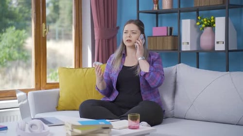 Woman Talking Angrily on Phone Indoors