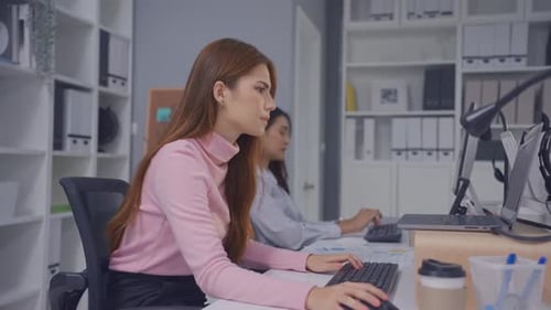 Asian beautiful businesswoman using laptop computer working in office.