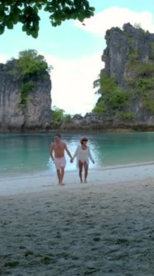 Couple Men and Women on a Tropical White Beach in Thailand Koh Hong Island Krabi