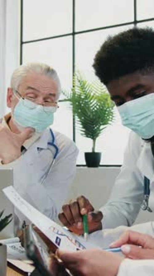 Medical Professionals Reviewing Patient Data in Office Setting