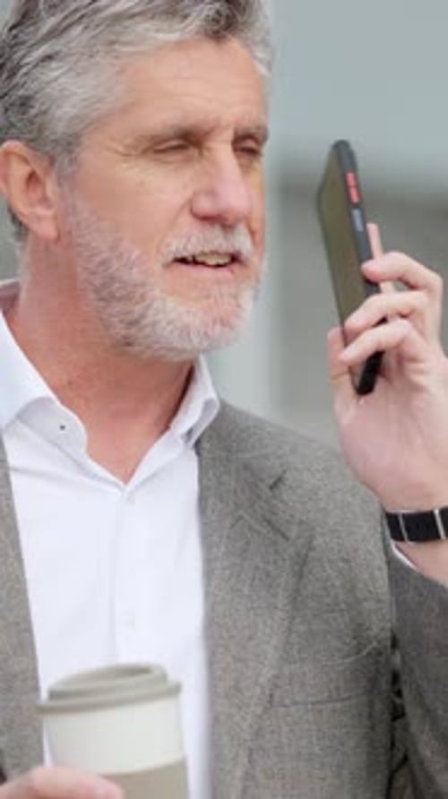 Man With Gray Hair Talking on Phone