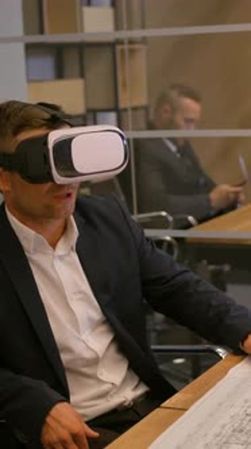 Man Wearing VR Headset in Modern Office