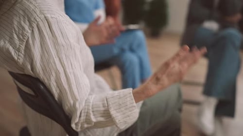 Group of People Talking in a Meeting Indoors