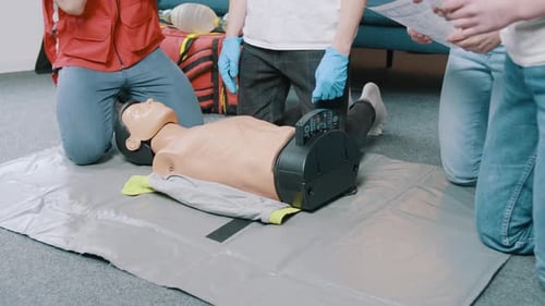 CPR Training with Dummy in Workplace
