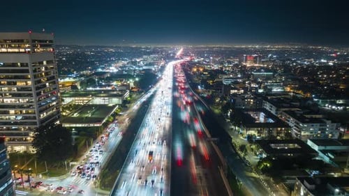 Cinematic Hyper Lapse Aerial Footage Zoom Out Flying Back 405 Highway at Night