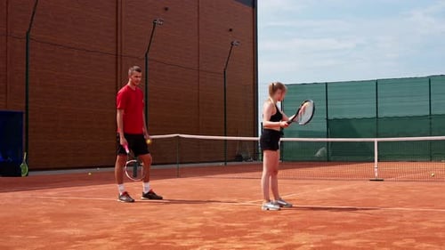 Tennis Players on Court Ready for Game