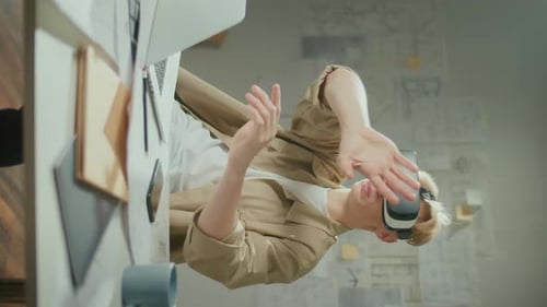 Adult Uses Virtual Reality Headset in Office