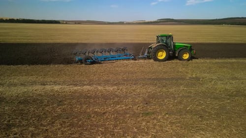 Tractors plowing the field in Ukraine